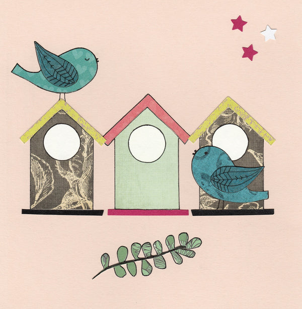 Greeting Card with pink background featuring 2 blue birds and multi coloured birdhouses. Good to give for housewarming or any occasion. Made by Mr Kite Designs